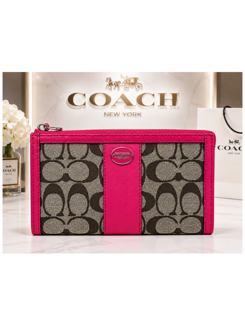 Coach Signature Canvas and Leather Zippy Wristlet.